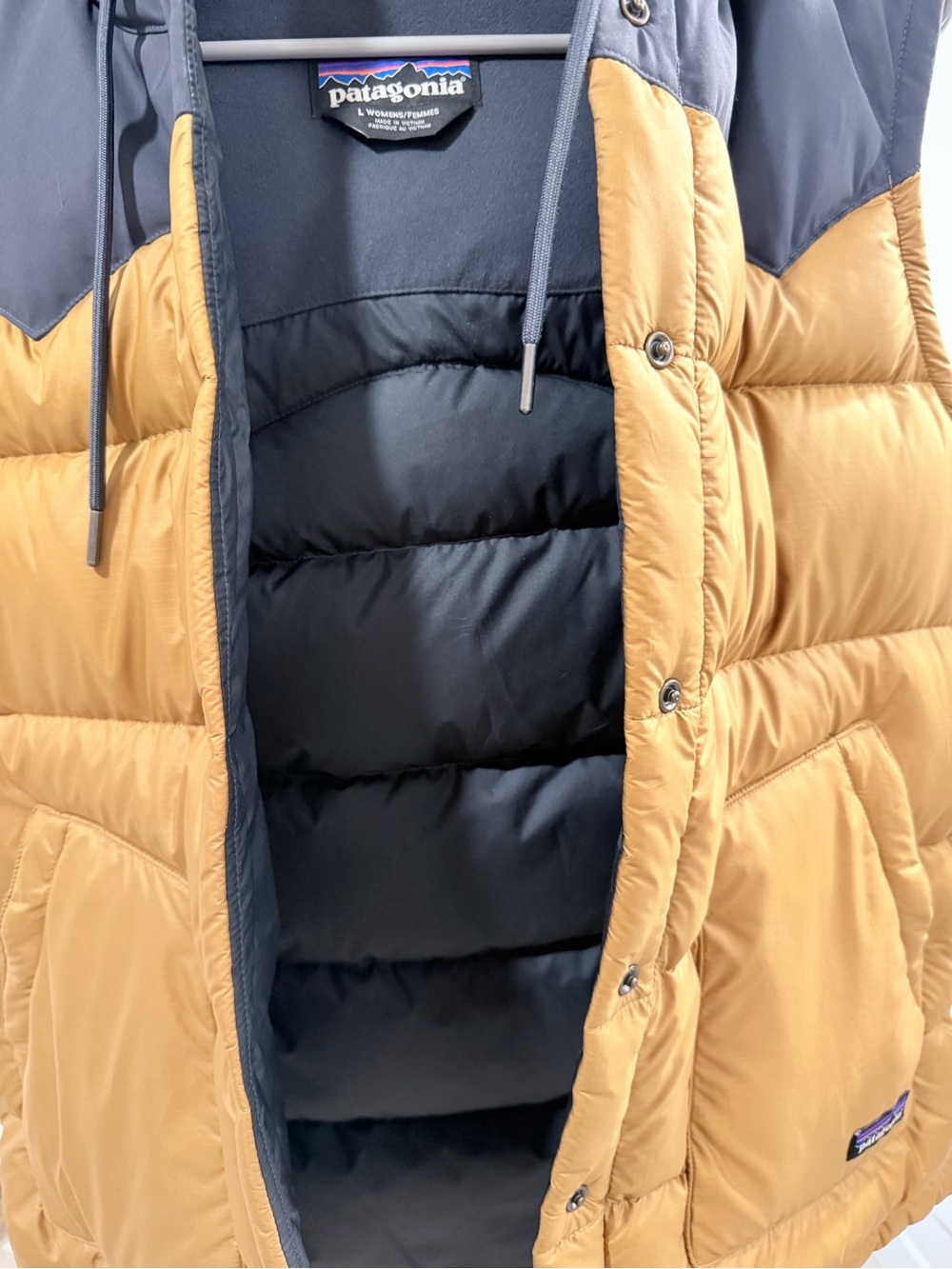 Patagonia Women’s' Two-Tone Puffer Vest in light golden brown and Navy - Picture 3 of 5
